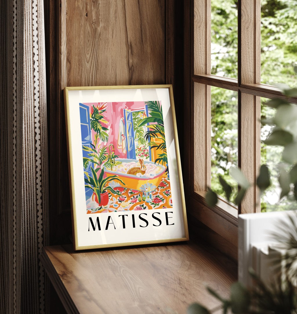 Framed art print in Henri Matisse style featuring a rabbit in a lush plant filled bathroom.