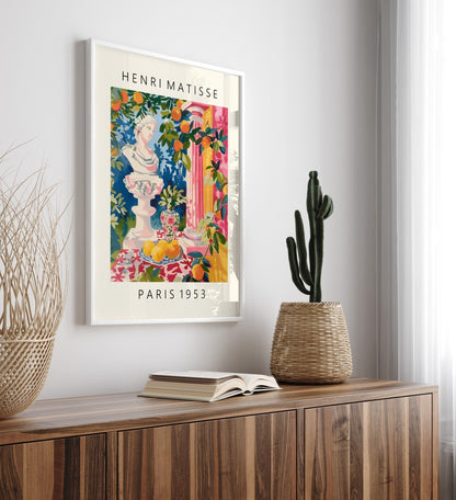 Classical statue with colorful still life in a framed Matisse-inspired print.