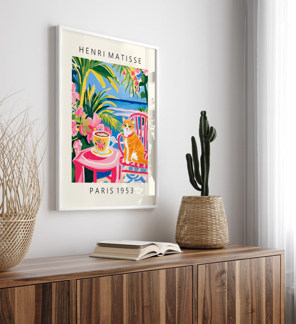 Framed orange cat with floral coffee cup surrounded by vibrant tropical plants art print