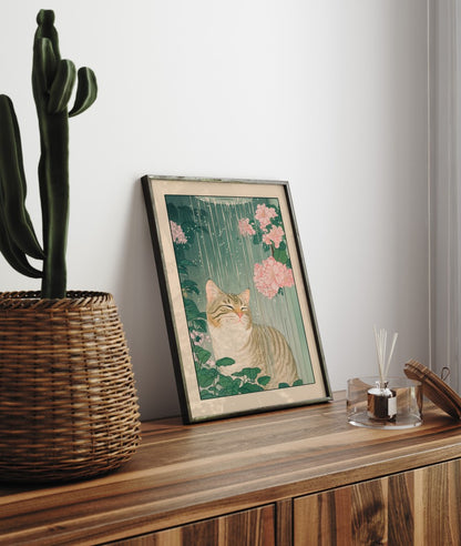 Bathroom wall art featuring a cat under running water